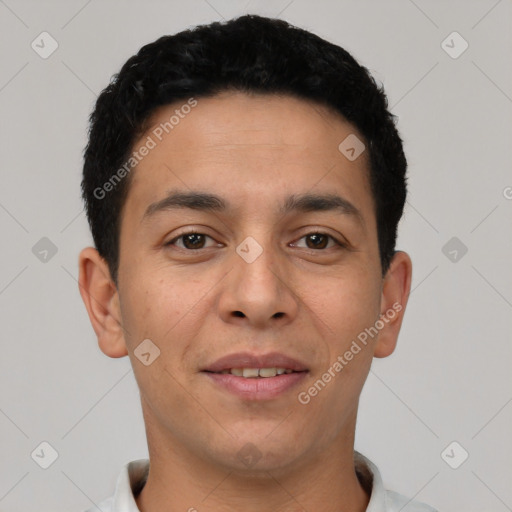 Joyful latino young-adult male with short  black hair and brown eyes