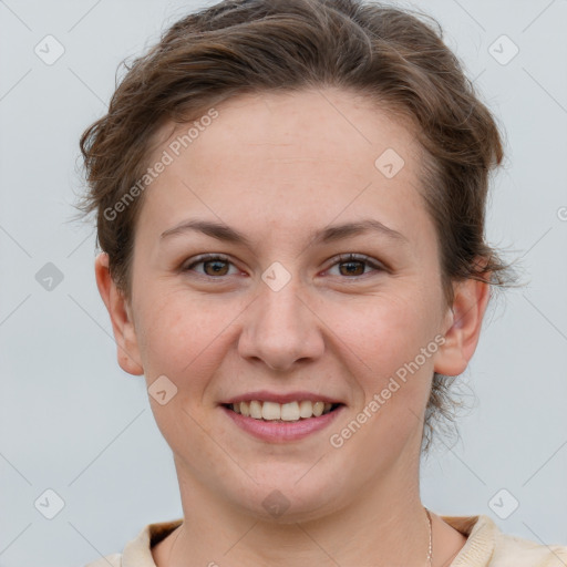 Joyful white young-adult female with short  brown hair and grey eyes