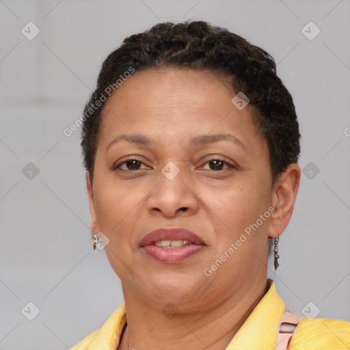 Joyful black adult female with short  brown hair and brown eyes