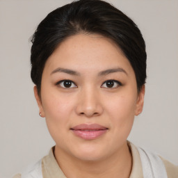 Joyful asian young-adult female with medium  brown hair and brown eyes