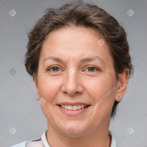 Joyful white adult female with short  brown hair and brown eyes