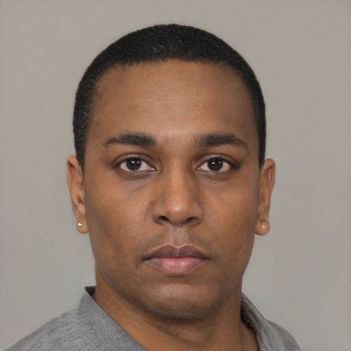 Neutral black young-adult male with short  black hair and brown eyes