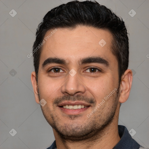 Joyful white young-adult male with short  black hair and brown eyes