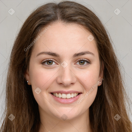 Joyful white young-adult female with long  brown hair and green eyes