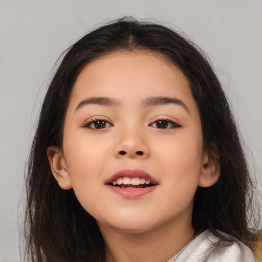 Joyful white child female with long  brown hair and brown eyes