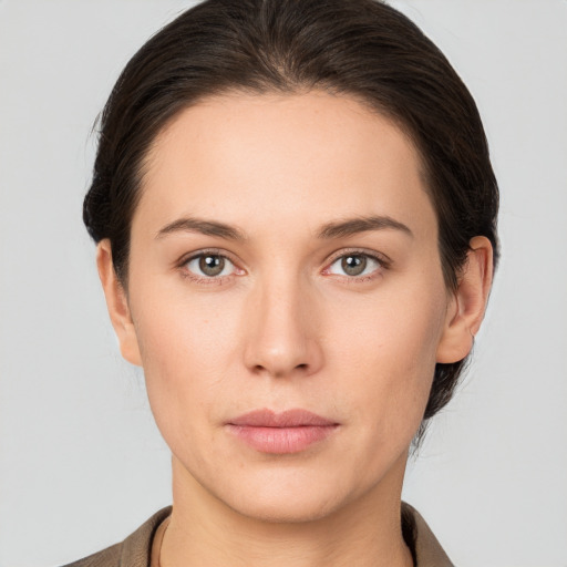 Neutral white young-adult female with short  brown hair and brown eyes