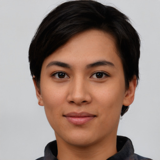 Joyful asian young-adult female with short  black hair and brown eyes