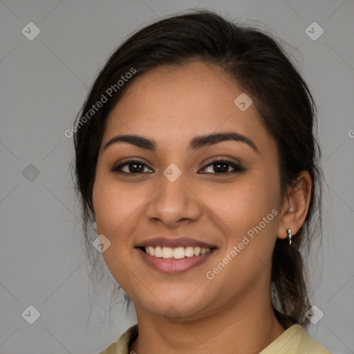 Joyful latino young-adult female with medium  brown hair and brown eyes