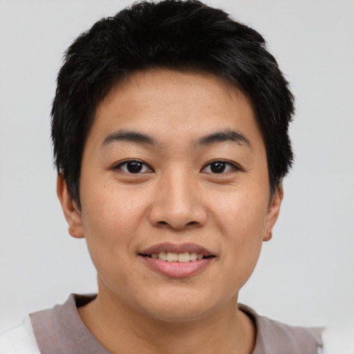 Joyful asian young-adult male with short  black hair and brown eyes