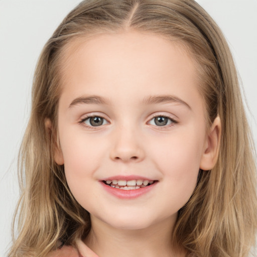 Joyful white child female with long  brown hair and grey eyes