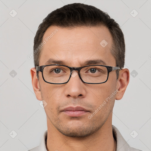 Neutral white young-adult male with short  brown hair and brown eyes