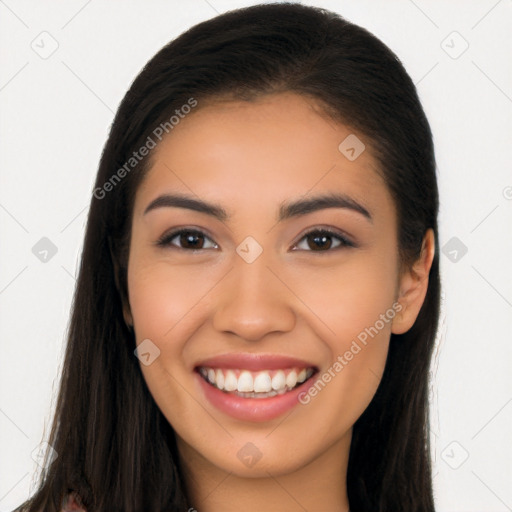 Joyful latino young-adult female with long  brown hair and brown eyes