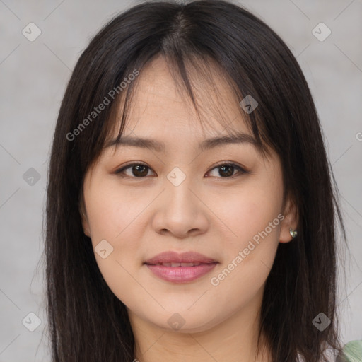 Joyful asian young-adult female with long  brown hair and brown eyes