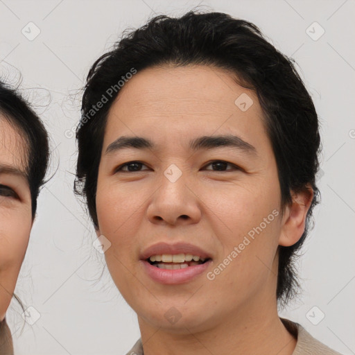 Joyful asian young-adult female with medium  brown hair and brown eyes