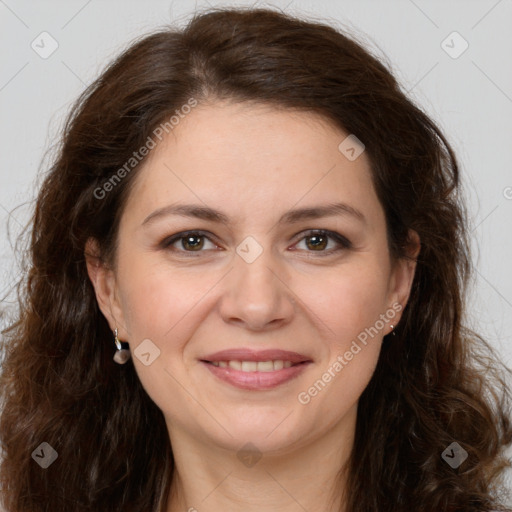 Joyful white adult female with long  brown hair and brown eyes