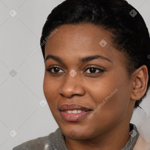 Joyful black young-adult female with short  black hair and brown eyes