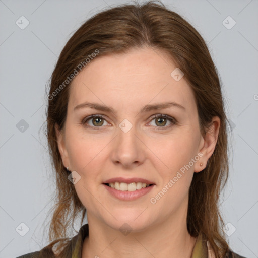 Joyful white young-adult female with long  brown hair and grey eyes