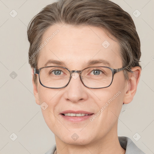 Joyful white adult female with short  brown hair and grey eyes