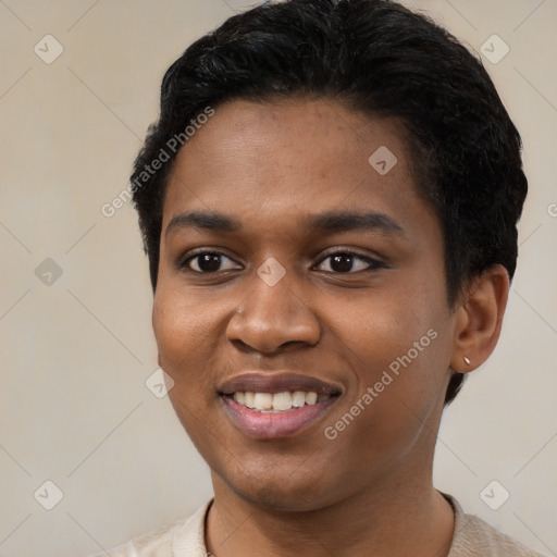 Joyful black young-adult female with short  brown hair and brown eyes