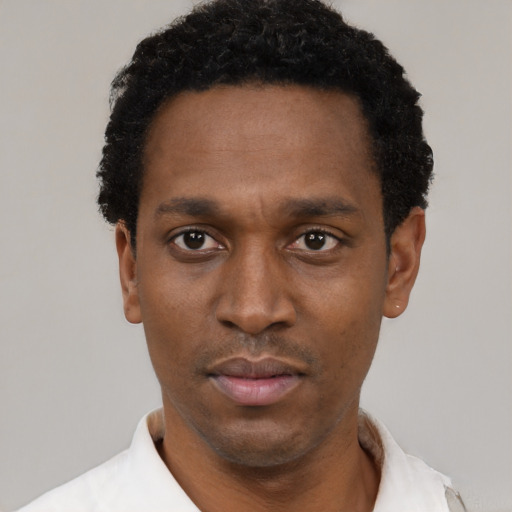 Neutral latino adult male with short  black hair and brown eyes