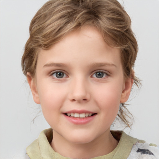 Joyful white child female with short  brown hair and grey eyes