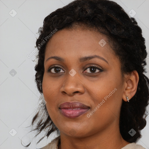 Joyful black young-adult female with medium  black hair and brown eyes