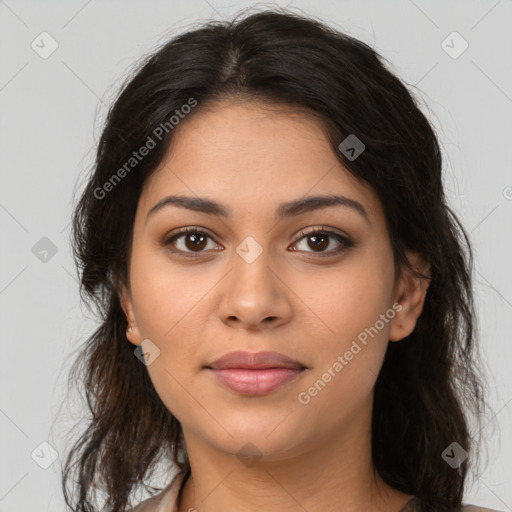 Joyful latino young-adult female with long  brown hair and brown eyes