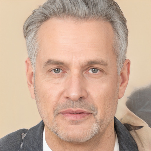 Neutral white middle-aged male with short  gray hair and brown eyes