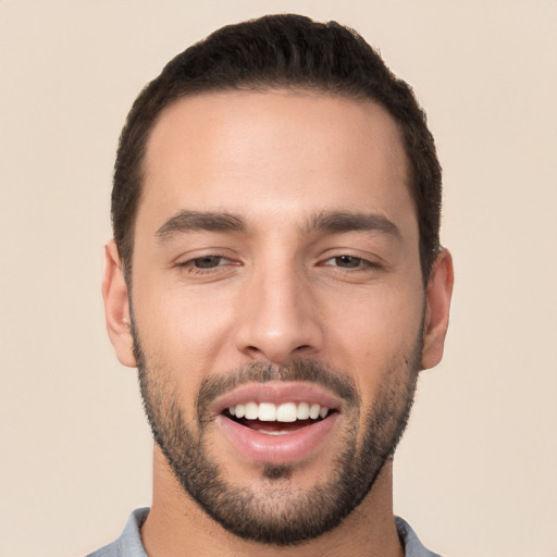 Joyful white young-adult male with short  black hair and brown eyes