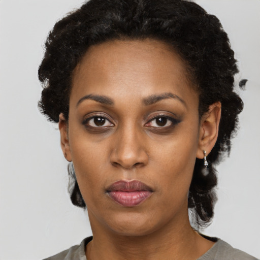 Neutral black young-adult female with short  black hair and brown eyes