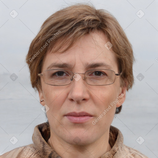 Joyful white adult female with short  brown hair and grey eyes