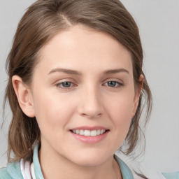 Joyful white young-adult female with medium  brown hair and blue eyes