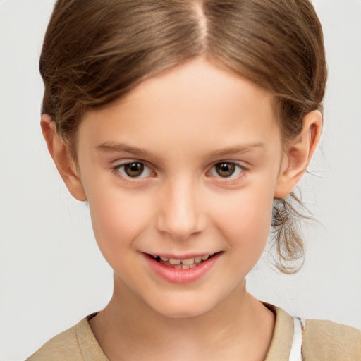 Joyful white child female with short  brown hair and brown eyes