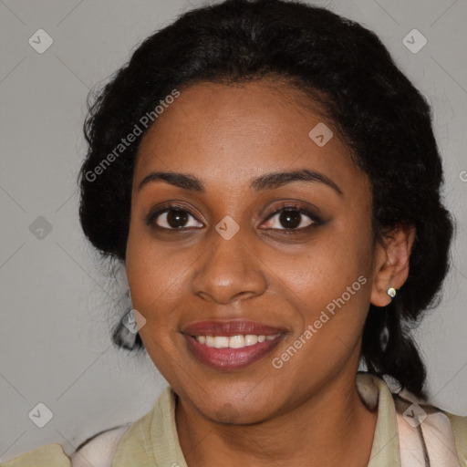 Joyful black young-adult female with long  black hair and brown eyes