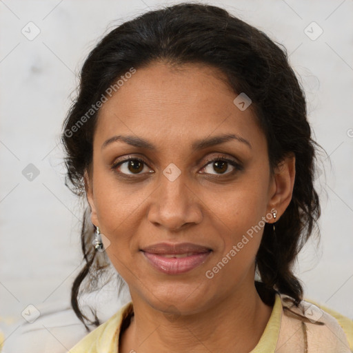 Joyful black adult female with medium  brown hair and brown eyes