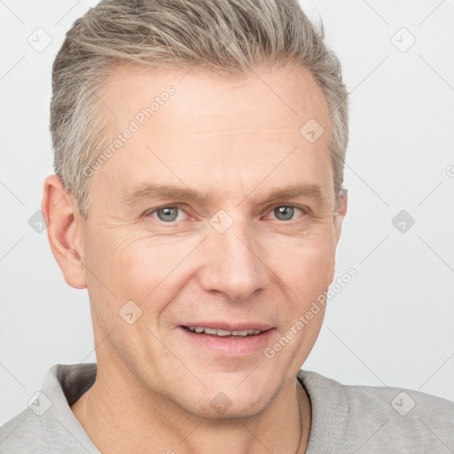 Joyful white adult male with short  brown hair and grey eyes