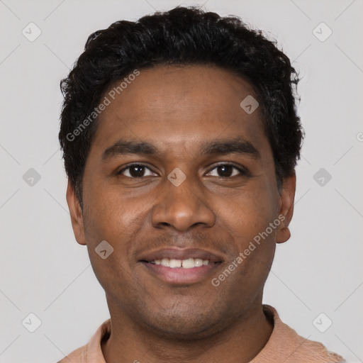 Joyful black young-adult male with short  black hair and brown eyes