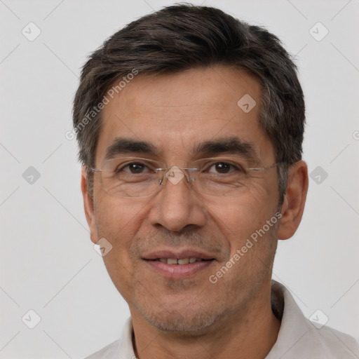 Joyful white adult male with short  black hair and brown eyes