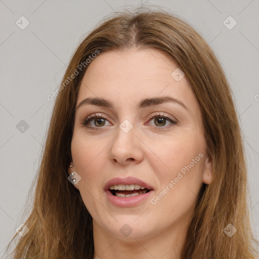 Joyful white young-adult female with long  brown hair and brown eyes