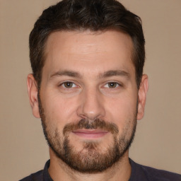 Joyful white adult male with short  brown hair and brown eyes