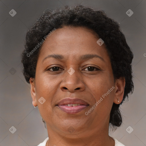 Joyful black adult female with short  brown hair and brown eyes