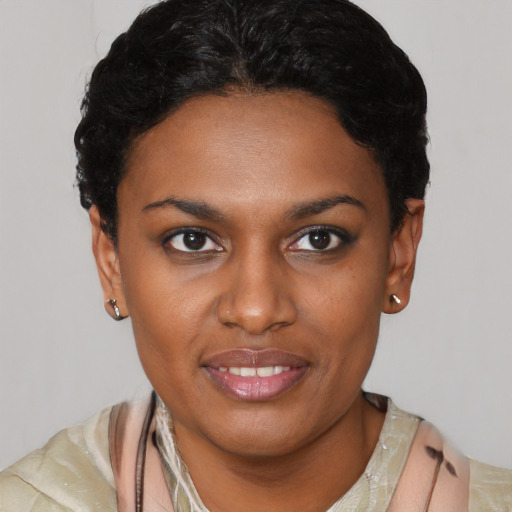 Joyful latino young-adult female with short  black hair and brown eyes