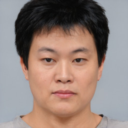 Neutral asian young-adult male with short  brown hair and brown eyes