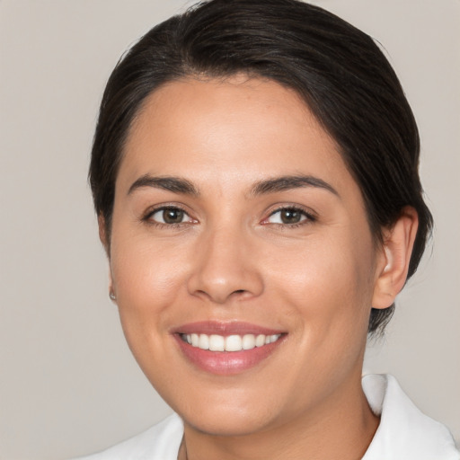 Joyful white young-adult female with medium  brown hair and brown eyes