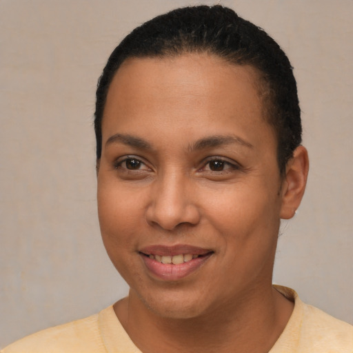 Joyful latino young-adult female with short  brown hair and brown eyes
