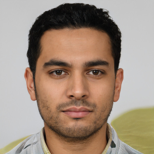 Neutral latino young-adult male with short  black hair and brown eyes