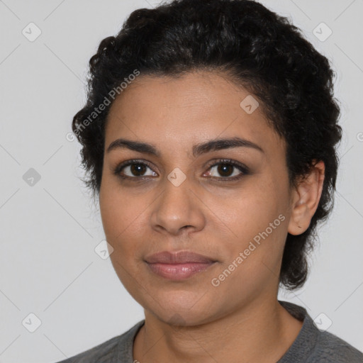 Joyful latino young-adult female with short  black hair and brown eyes