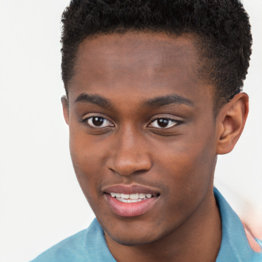 Joyful black young-adult male with short  brown hair and brown eyes