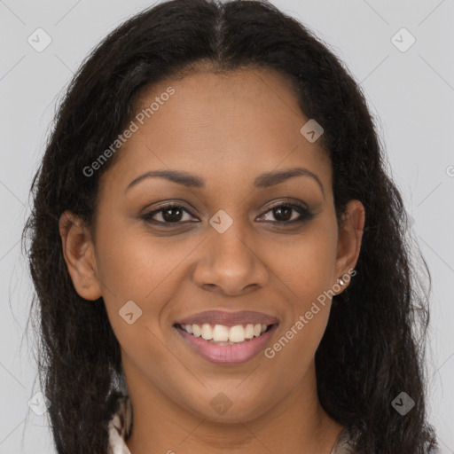 Joyful black young-adult female with long  brown hair and brown eyes