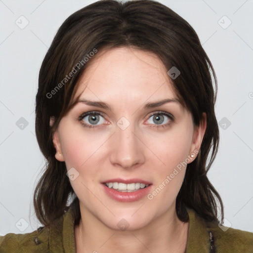 Joyful white young-adult female with medium  brown hair and green eyes